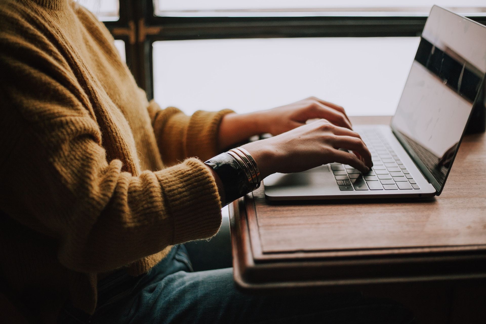 man typing on a computer
